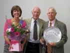 Brian Taylor (right) with his wife Anne, receives the 2017 Carlo Naef Trophy from Peter Ruysen.